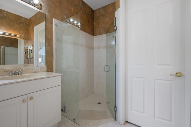 bathroom featuring vanity and a shower with shower door