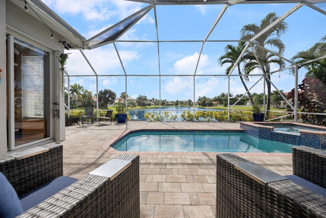 view of swimming pool featuring an in ground hot tub, a water view, a patio, and a lanai