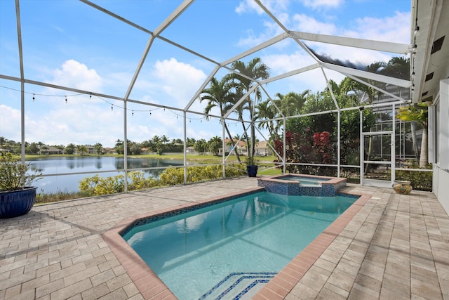 view of swimming pool featuring an in ground hot tub, a water view, glass enclosure, and a patio