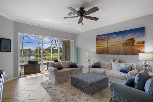 tiled living room with a water view, ceiling fan, and ornamental molding