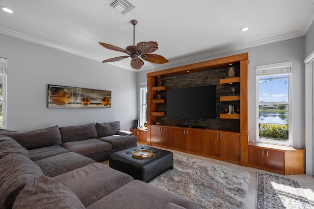 living room with ornamental molding, light tile patterned floors, and ceiling fan