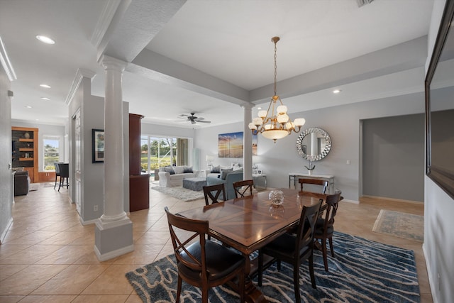 tiled dining space with crown molding, ceiling fan, and ornate columns