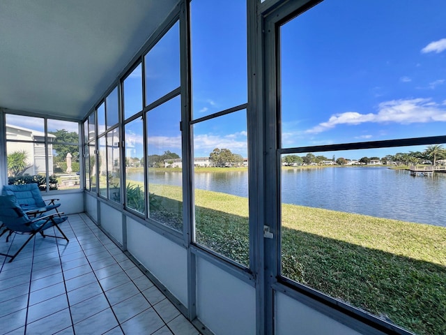 unfurnished sunroom with a water view