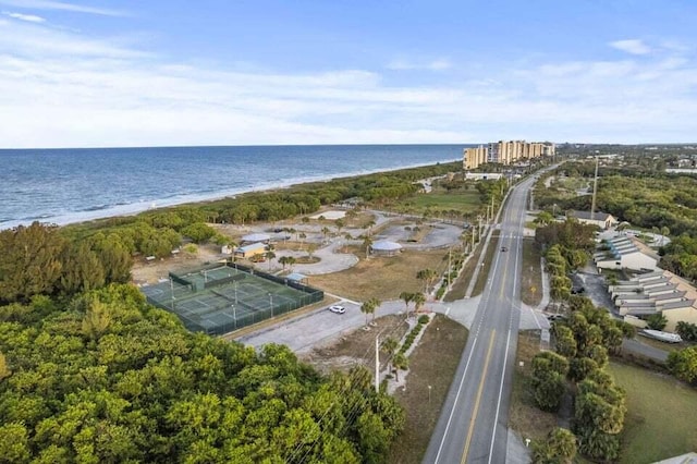 bird's eye view featuring a water view and a view of the beach