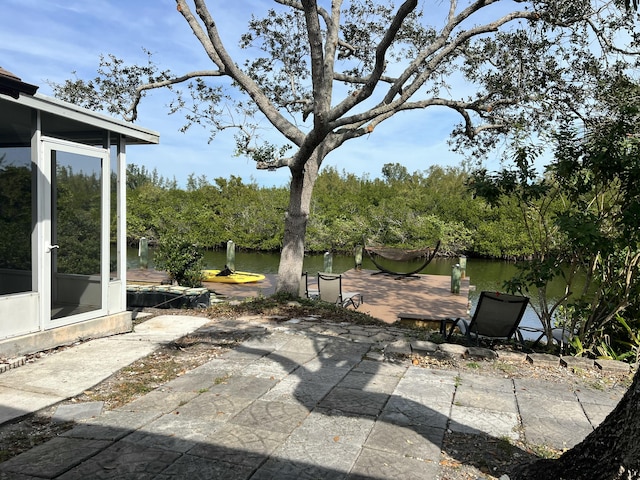 view of patio with a water view