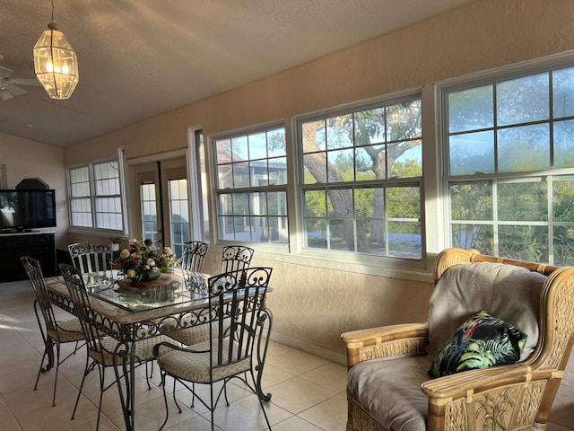 dining room featuring light tile patterned flooring and a textured ceiling