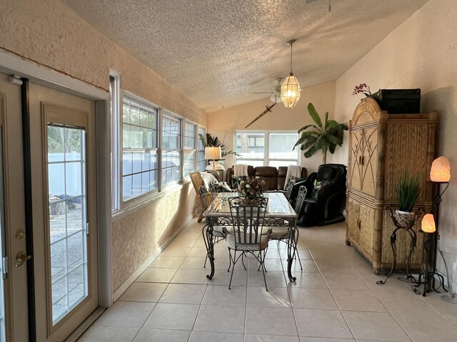 living room featuring a textured ceiling and light tile patterned flooring