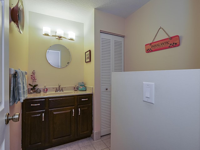 bathroom with tile patterned floors and vanity