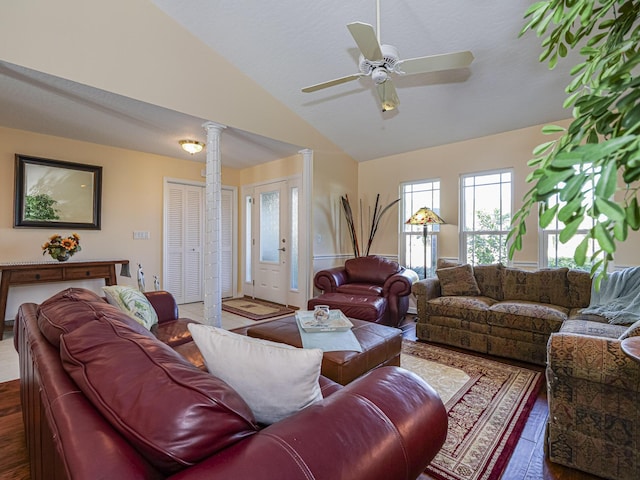 living room featuring ceiling fan, lofted ceiling, dark hardwood / wood-style floors, and decorative columns