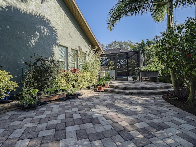 view of patio / terrace with glass enclosure