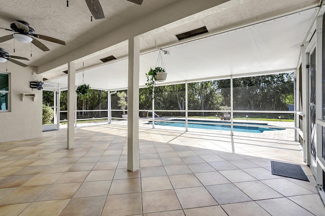 view of swimming pool with ceiling fan and a patio area