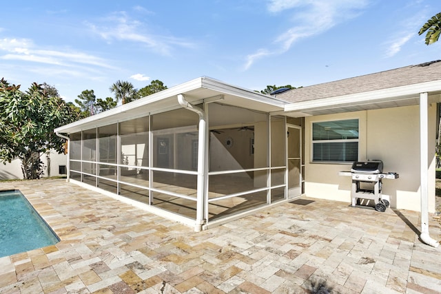 exterior space featuring grilling area and a sunroom