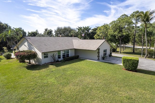 ranch-style home with a front yard