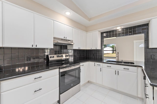 kitchen with white cabinetry, stainless steel electric range oven, sink, and tasteful backsplash