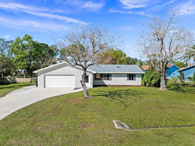 ranch-style home featuring fence, concrete driveway, a front yard, stucco siding, and a garage