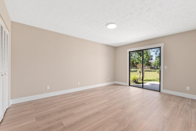 interior space featuring light hardwood / wood-style flooring, access to outside, and a closet