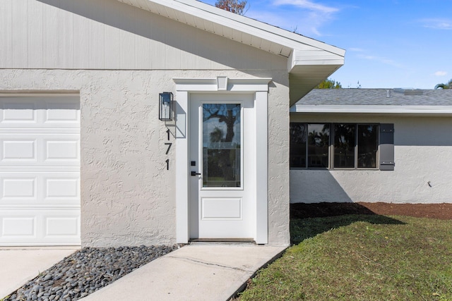 entrance to property featuring a garage