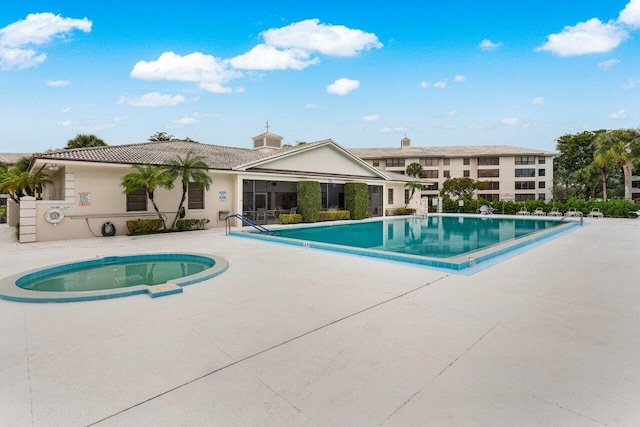 view of swimming pool with a patio area