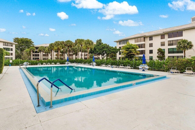 view of swimming pool with a patio