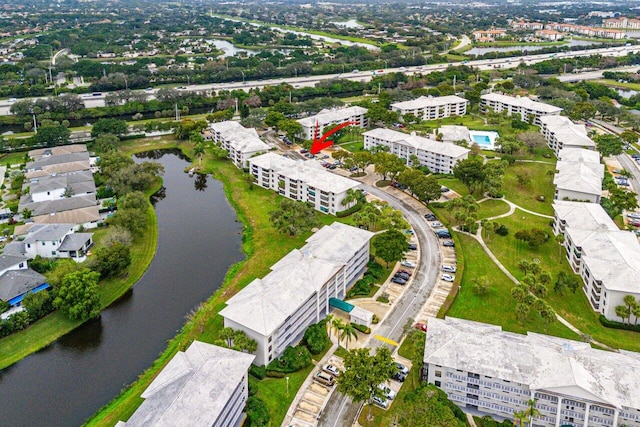 birds eye view of property featuring a water view