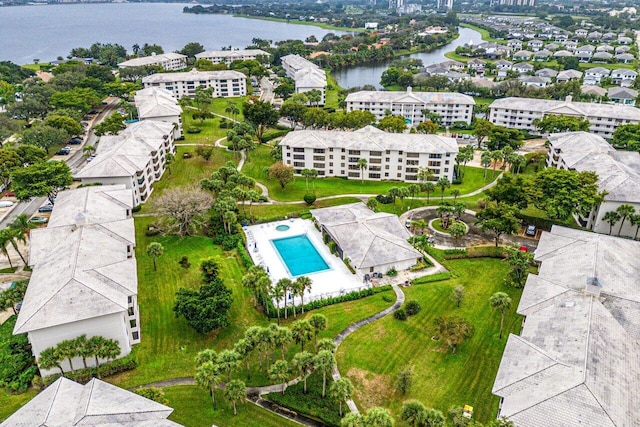 birds eye view of property with a water view