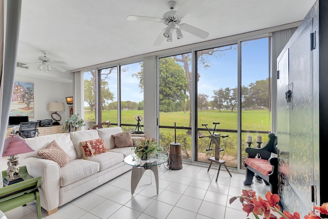 sunroom featuring ceiling fan