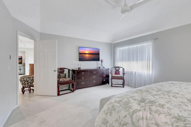 bedroom with light colored carpet and ceiling fan