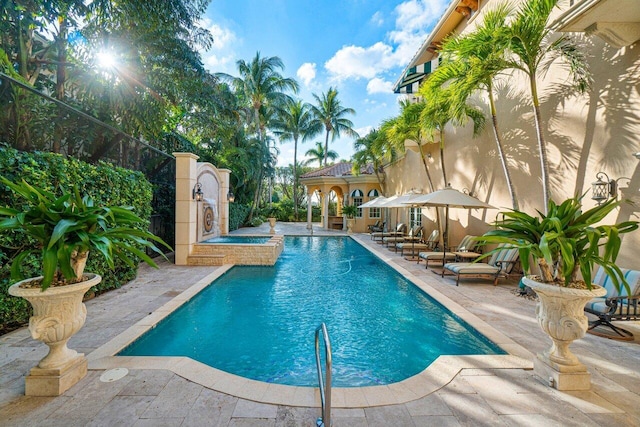 outdoor pool with a patio