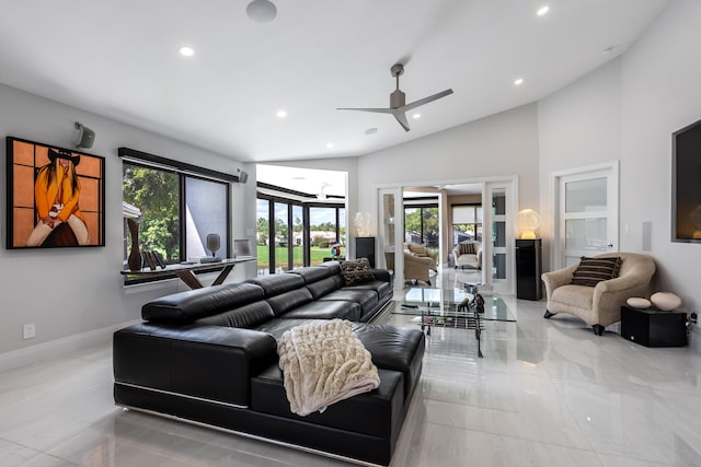 living room featuring ceiling fan and high vaulted ceiling