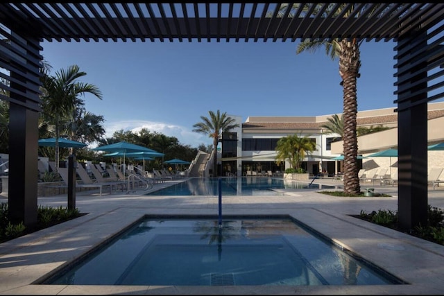 view of pool with a community hot tub and a patio area