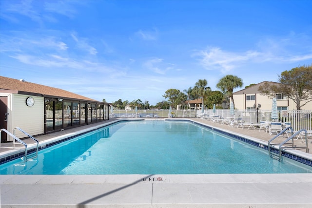 view of swimming pool with a patio area