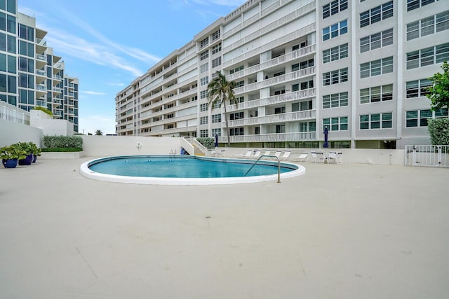 view of swimming pool with a patio