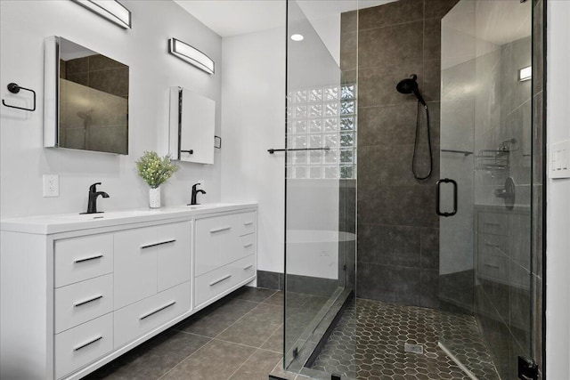 bathroom featuring tile patterned floors, vanity, and an enclosed shower