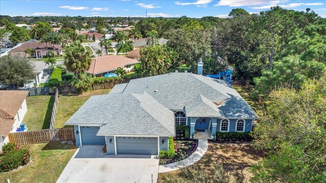 single story home with a garage and a front yard