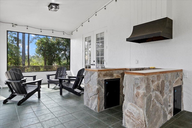 view of patio featuring an outdoor bar