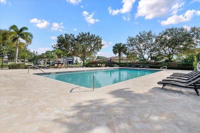 view of swimming pool featuring a patio