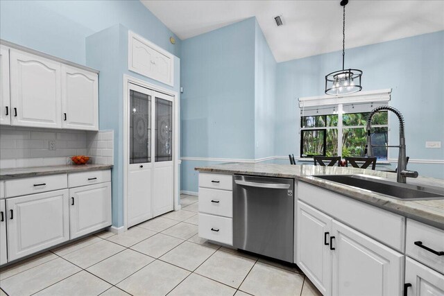 room details with stainless steel refrigerator with ice dispenser and white cabinets