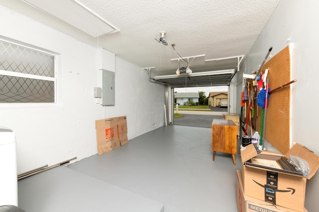 garage featuring a garage door opener and electric panel