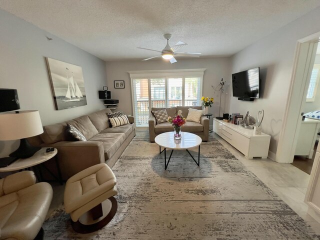 bedroom with a textured ceiling and ceiling fan