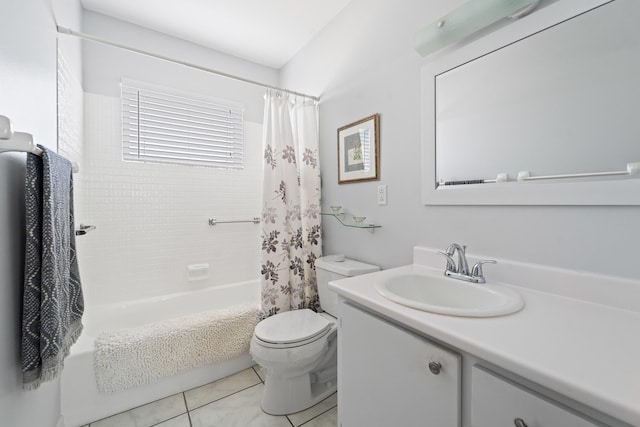 full bathroom featuring vanity, toilet, tile patterned flooring, and shower / tub combo