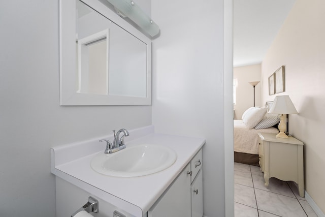 bathroom featuring tile patterned flooring and vanity