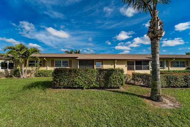 ranch-style house with a front yard