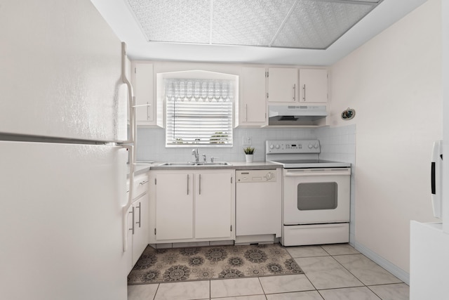 kitchen with sink, light tile patterned floors, white appliances, decorative backsplash, and white cabinets