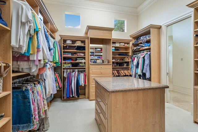 spacious closet featuring light colored carpet