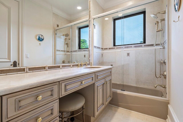 full bath featuring combined bath / shower with glass door, ornamental molding, tile patterned flooring, and vanity