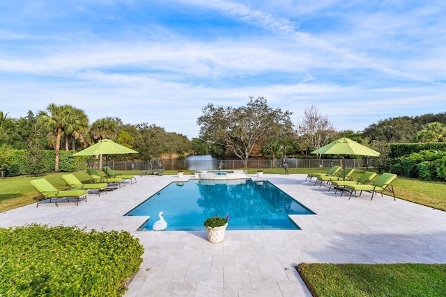 view of pool featuring an in ground hot tub, a water view, a patio, and a lawn