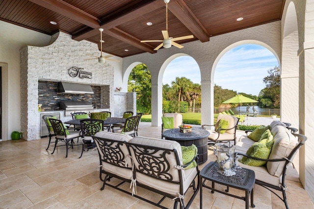 view of patio / terrace with area for grilling, an outdoor living space, ceiling fan, and outdoor dining space