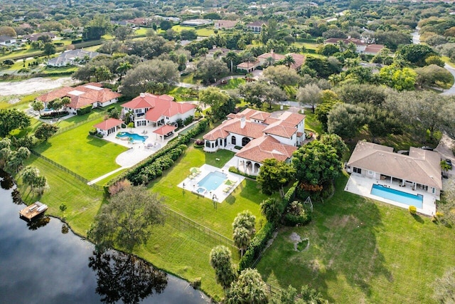 birds eye view of property featuring a residential view and a water view