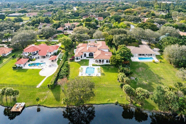 birds eye view of property with a water view