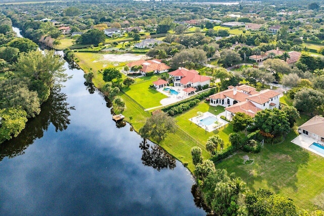 bird's eye view with a residential view and a water view